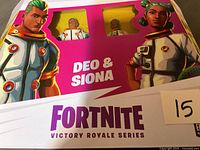 Box front showing Fortnite Victory Royale Series Deo & Siona figures with character art and clear windows showing figures inside.