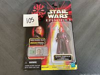 Front view of Star Wars Episode 1 Queen Amidala figurine in original packaging with CommTech chip accessory visible.