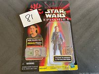 Photo of first Star Wars Episode 1 Padmé Naberrie action figure sealed in original packaging showing figure and pod race view screen accessory