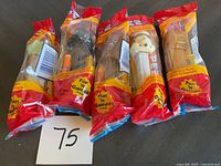 Five Star Wars Pez dispensers sealed in original packaging, viewed from front and side angles.