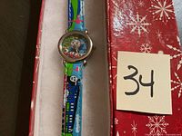Front view of Thomas the Train watch in box, showing colorful character strap and dial.