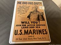 Photo of a 12x18 inch metal U.S. Marines recruitment sign with an image of an officer in uniform and recruitment text.
