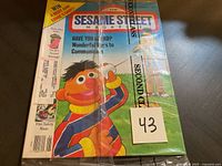 Front cover of the sealed 1992 Sesame Street magazine showing Ernie and text about communication and activities inside.