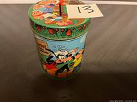 Side view showing Goofy in a bubble bath scene with Mickey Mouse and Donald Duck