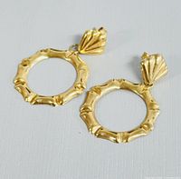Top angle photo showing the bamboo style hoop earrings with scalloped shell tops.