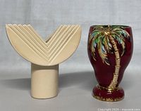 View showing both vases side by side, Beswick palm tree vase in red and beige Art Deco vase with geometric pattern.