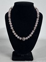 Full front view of the 20-inch rose quartz and silver bead necklace displayed on a black bust, showing the size and bead arrangement.