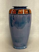 Front view of vintage Japanese lusterware porcelain vase showing full body and decorative band near rim.
