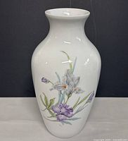 Front view of the 11-inch white porcelain vase with floral painting
