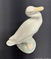 Front angle of vintage Lladro porcelain goose figurine showing the curved neck and base details.