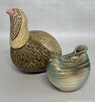 Front-left view of the bird figurine and rooster vase showing size and detailing.