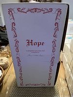 Box with text 'Hope' and signature of sculptor Connie Walser Derek