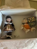 Box containing the doll, plush bear, and Halloween blocks