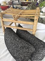 Bamboo stool with 2 black and white accent pillows