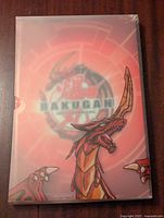 Front cover of Bakugan binder showing Drago artwork and Bakugan logo