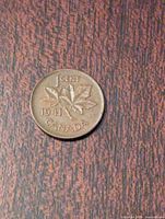 Reverse side of the 1941 Canadian penny showing denomination, year, and maple leaf design.