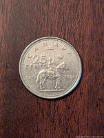 Obverse side of the coin showing 'CANADA', '25 CENTS', the RCMP officer on horseback, and the years '1873' and '1978'.