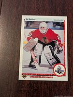 Front of Ed Belfour rookie card from 1990-91 Upper Deck showing goaltender in Chicago Blackhawks uniform.