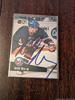 Front of the 1991-92 Pro Set NHL hockey card showing Bill Berg in New York Islanders uniform with blue signature.
