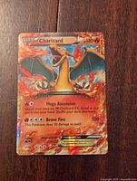 Front photo of Charizard EX XY17 Holofoil Pokemon card showing artwork, HP and attack details.