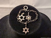 Silver Thomas Sabo charm bracelet and two additional Star of David charms.