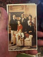 Photo of single postcard with group portrait of Queen Elizabeth II family