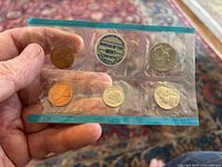 Photo showing the 1969 Philadelphia Mint Set with coins in original sealed packaging, the packaging has a Bureau of the Mint sticker.