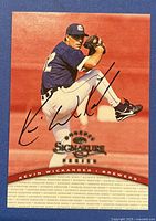 Front view of the autographed 1997 Donruss Signatures Kevin Wickander card showing the player in pitching stance in Brewers uniform with autograph on the card.