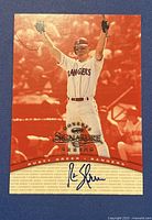 Front of 1997 Donruss Signatures Rusty Greer autographed baseball card showing player image and autograph in blue ink.