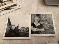 Black and white photo of two men standing outside near house and car on a driveway; photo of older man and woman sitting closely together indoors