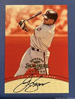 Front of card showing J.T. Snow batting and autograph in black ink