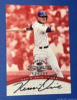 Front of the 1997 Donruss Signatures Kevin Orie autographed baseball card with image of player batting and printed autograph.