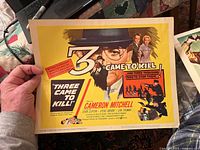 Lobby card for the 1950s movie 'Three Came to Kill' featuring bright yellow background and illustrated characters with title text.