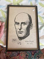 Frontal image of the framed black and white print of Wilbur Wright by Milton Caniff.