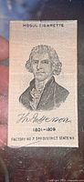 Front side showing detailed portrait of Thomas Jefferson with text and signatures printed on tobacco silk