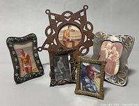 Photo showing all five vintage and antique mini photo frames with individual photos, arranged on a white background.