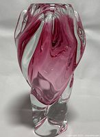 Photo showing front angled view of the vase highlighting pink and clear glass swirls.
