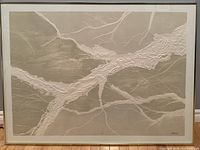Frontal view of large framed woodcut print of tree branches, showing full artwork and frame.
