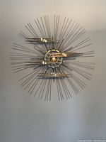 Front view showing entire round sunburst sculpture
