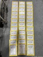 Overview photo showing a layout of 36 National Geographic magazines in four neat rows, each with the distinct yellow border and readable text on the front covers.