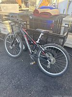 Full side view of the Specialized Hotrock 7 mountain bike showing the frame, wheels, and handlebars.