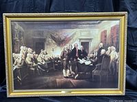 Full view of the framed print showing the complete scene of "The Signing" with gold-colored ornate frame.