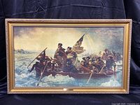 Full frontal view of framed canvas print depicting Washington Crossing the Delaware in ornate gold-tone frame
