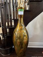 Front view of tall vase showing overall shape and design.