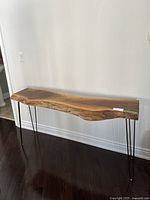 Full front view of live edge tabletop and hairpin legs