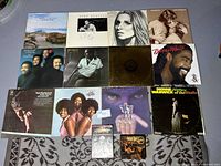 Top view showing all vinyl records, CD set, and DVD arranged on a table.