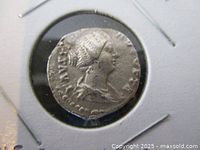 Obverse side of the Ancient Roman silver coin featuring the bust of Empress Faustina II in profile, with visible inscriptions around the edge.