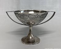 Front view of the silver sterling tennis tournament trophy with engraved text for Racine Golf Club Tennis Tournament.