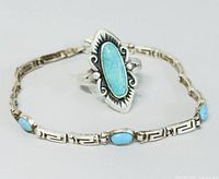 Ring and bracelet displayed together on plain white background