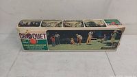 Full view of original vintage Skowhegan croquet and golf set box showing condition and labeled features.